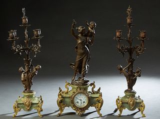 Three Piece Patinated Spelter and Green Onyx Figural Clock Set, c. 1900, with a Madrassi figural group "Jeune Mere," over a painted dial time and stri