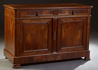 French Louis Philippe Carved Walnut Sideboard, 19th c., the canted corner ogee edge top above two frieze drawers over setback double paneled doors, fl