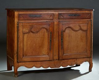 French Provincial Louis XV Style Carved Cherry Sideboard, 19th c., the stepped canted corner two board top over two fielded panel frieze drawers above