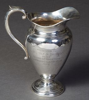 Sterling Silver Water Pitcher, c. 1940, by International, #57, the side engraved "Presented to Leon M. Wolf, Jr., President by the Board of Directors,