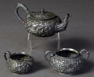 Three Piece Silverplated Tea Set, 19th c., by Justis and Armiger, Baltimore, with floral repousse decoration, consisting of a teapot, creamer, and ope