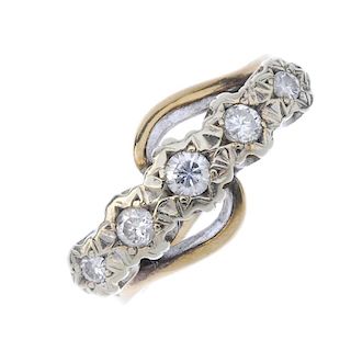An 18ct gold diamond five-stone ring. The brilliant-cut diamonds, to the asymmetric sides and plain