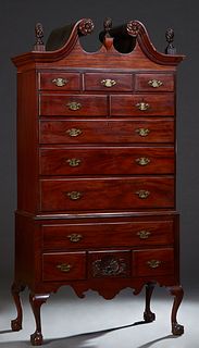 English Carved Mahogany Chippendale Style Highboy, late 19th c., broken arch crown with a central finial, flanked by two finials, over three frieze dr