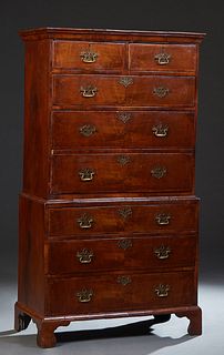 English Carved Mahogany Georgian Chest on Chest, early 19th c., the stepped ogee crown over two frieze drawers above three graduated drawers, with bra