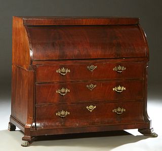 Dutch Carved Mahogany Cylinder Top Desk, 19th c., the rectangular top over a cylinder desk with a cantilevered writing slide, opening to an interior f