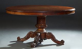 French Carved Walnut Center Table, c. 1870, the stepped oval top over a wide skirt, with beaded trim and two opposing frieze drawers on the long sides
