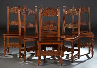 Set of Six Italian Carved Mahogany Dining Chairs, early 20th c., the leaf carved scrolled stiles, joined by scroll carved horizontal splats, to trapez