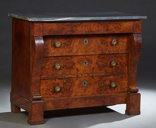 French Louis Philippe Carved Walnut Marble Top Commode, 19th c., the figured gray marble over a frieze drawer above three setback deep drawers, flanke