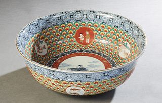 Large Japanese Imari Porcelain Punch Bowl, 20th c., with a blue floral border over intricate painted decoration and reserves of children, the undersid