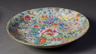 Large Chinese Qing Dynasty Style Porcelain Bowl, 20th c., with "Mille Fleurs" decoration and a gilt edge rim, the pale blue glazed underside with a si