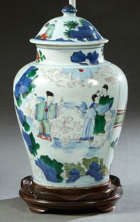 Wucai Baluster Jar and Cover, possibly Qing Dynasty, with scenic, figural and cloud decoration, now with a hardwood base mounted as a lamp, Jar- H.- 1