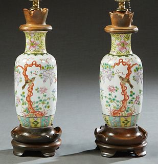 Pair of Chinese Famille Rose Porcelain Baluster Vases, 19th c., with bird and floral decoration on a yellow ground, now mounted on wooden bases as lam