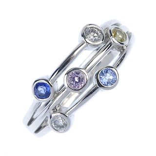 An 18ct gold gem-set and diamond dress ring. Of openwork design, the multi-colour sapphires and bril