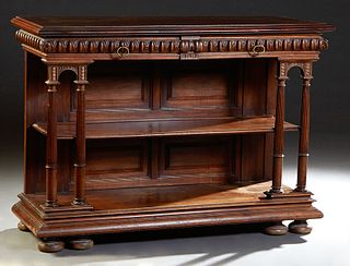 French Henri II Style Carved Walnut Sever, c. 1880, the stepped ogee top lifting to a folding shelf over an inset highly figured brown marble, over tw