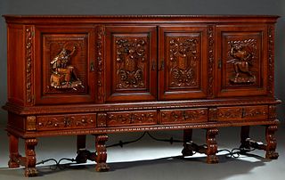 French Renaissance Style Carved Beech Sideboard, 19th c., the gadroon edge top over four cupboard doors carved with knights and coats-of-arms, on a ba