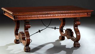Spanish Carved Beech Renaissance Style Dining Table, 20th c., the gadroon edge rectangular top on large trestle form supports with large paw feet, joi