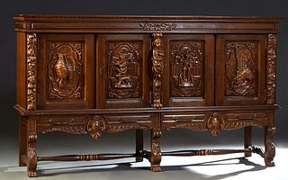 Spanish Renaissance Style Carved Oak Sideboard, 20th c., the stepped crown over four doors carved with game birds and an agrarian couple, flanked by f