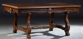 Spanish Renaissance Style Carved Oak Drawleaf Dining Table, 20th c., the gadrooned edge top over a wide scalloped skirt with two draw leaves, on reede