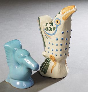Two Pieces of Shearwater Pottery, 20th/21st c., consisting of a blue glazed pelican bookend and a toucan pitcher, Pitcher- H.- 13 1/2 in., W.- 5 1/4 i