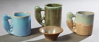 Four Pieces of Shearwater Pottery, 21st c., consisting of three woodpecker handled mugs, and a small brown glazed tapered bowl, Largest Mug- H.- 4 3/4