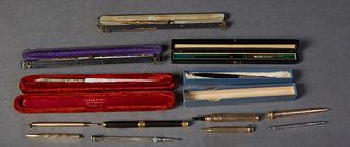 Group of Thirteen Writing Implements, 19th/20th c., consisting of three mother-of-pearl dip pens, in original boxes; an agate dip pen in original leat
