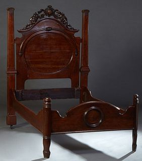 Carved Walnut Highback Single Bed, late 19th c., probably New Orleans, the arched headboard with a pierced C-scroll and egg crest, flanked by reeded s