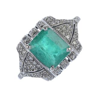 An emerald and diamond dress ring. The rectangular-shape emerald, within a pave-set diamond geometri