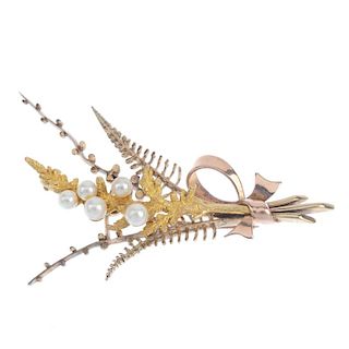 A 9ct gold cultured pearl foliate brooch. Designed as a fern, with cultured pearl accents and bow de