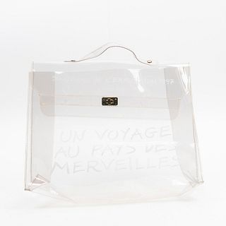 Hermes Limited Edition Souvenir de L'Exposition 1997 Handbag, in transparent vinyl with golden hardware, the front of the bag with "Un voyage au pay d