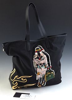 Prada Robot Tote Bag, in black tessuto nylon canvas with a mixed media figure on the front, the interior of the bag lined in black Prada monogram with