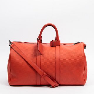 Louis Vuitton Keepall Bandouliere 45 Travel Bag, c. 2011, in flashy orange damier infini calf leather with aged brass hardware, opening to a dark grey