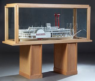 Ship Model, "Natchez VI," scratch-built model, 20th c., presented in a custom oak glass case, on a plinth support, Model- H.- 27 in., W.- 641/2 in., D