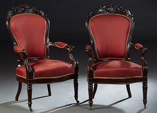 Pair of French Louis XVI Style Carved Mahogany Fauteuils, 19th c., the canted scroll and egg carved crest over an upholstered shield back, over a bowe