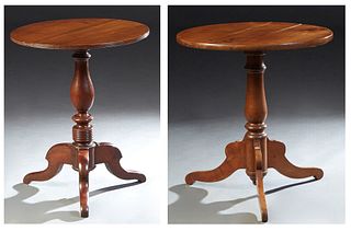 Two French Carved Walnut Pedestal Tables, 19th c., the circular top on a turned urn support to tripodal cabriole legs, H.- 28 5/8 in. Dia.- 27 in., an