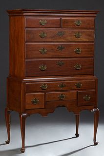 English Style Carved Mahogany Queen Anne Highboy, 20th c., the stepped ogee crown over an upper section with two frieze drawers above three graduated 