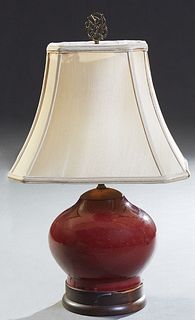 Chinese Oxblood Porcelain Baluster Urn, 20th c., now mounted as a lamp on a wooden base with a wooden cap, Vase H.- 7 1/2 in., Dia.- 9 in. Lamp H.- 10