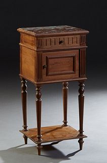 French Louis XVI Style Marble Top Nightstand, early 20th c., the inset highly figural brown marble over a frieze drawer and a pot cupboard planked by 
