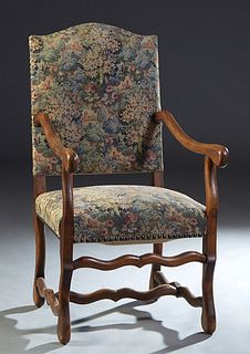 French Carved Beech Louis XV Style Fauteuil, early 20th c., the arched upholstered back to curved scrolled arms and a cushioned seat, on cabriole legs
