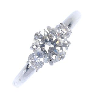A diamond single-stone ring. The circular-cut diamond, with brilliant-cut diamond sides, to the tape