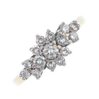 An 18ct gold diamond floral cluster ring. The brilliant-cut diamond cluster, with similarly-cut diam