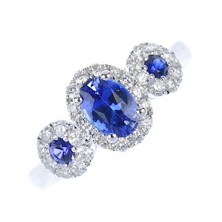 * A sapphire and diamond triple cluster ring. The three oval and circular-shape sapphires, each with