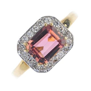 A topaz dress ring. The pink topaz, within a brilliant-cut diamond surround, to the tapered band. Es