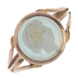 An early 20th century 9ct gold hardstone cameo ring. The circular hardstone cameo, carved to depict