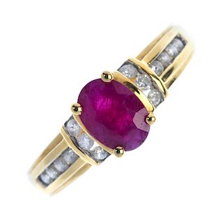 An 18ct gold ruby and diamond ring. The oval-shape ruby, with brilliant-cut diamond line sides and s