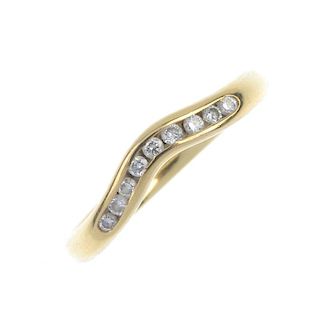 An 18ct gold diamond half-circle eternity ring. Designed as a channel-set brilliant-cut diamond curv