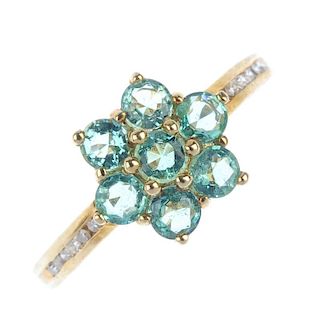 A 9ct gold emerald dress ring. The circular-shape emerald floral cluster, with single-cut diamond si