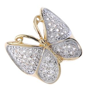 A 9ct gold paste butterfly ring. The circular-shape colourless paste butterfly, to the bifurcated sh