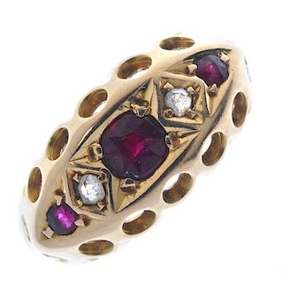 An Edwardian 18ct gold ruby and diamond ring. The graduated circular-shape ruby line, with rose-cut