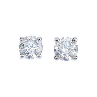 A pair of brilliant-cut diamond ear studs. Total diamond weight 0.50ct, stamped to mount, estimated,