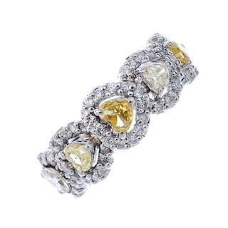 An 18ct gold diamond dress ring. Designed as a series of heart-shape diamonds, each within a brillia